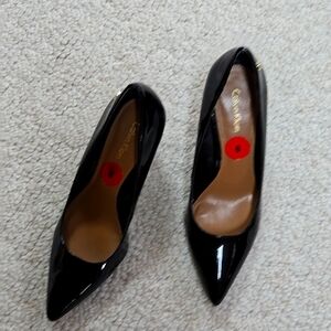 Calvin Klein patent pumps.